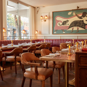 Red leather banquettes line the room. 