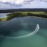 A boat heads into Seven Spirit Bay.