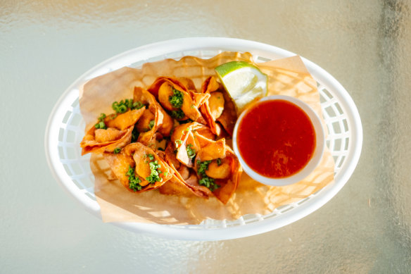 A basket of fried wontons. Perfect bowls snack.
