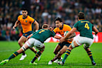 Springboks defenders try to shut down Len Ikitau.