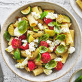 Rigatoni with zucchini and cherry tomatoes.