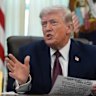 US President Donald Trump taking questions from reporters in the Oval Office on Tuesday.