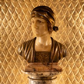 A sculpture of a woman at the State Theatre.