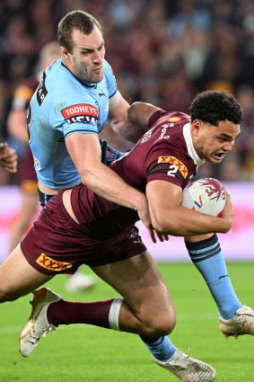 Isaah Yeo tackles Xavier Coates in game two.