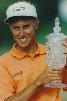 Robert Allenby with the winner’s trophy.