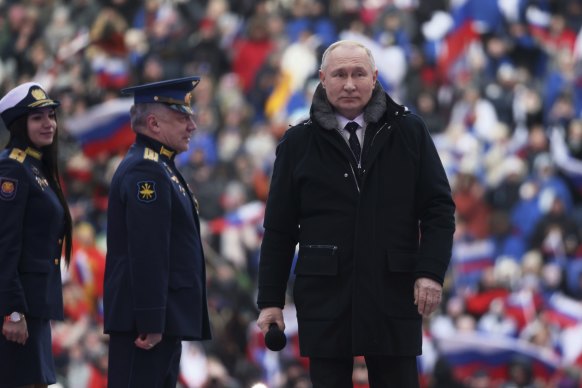 Russian President Vladimir Putin arrives to the “Glory to the Defenders of the Fatherland” concert.