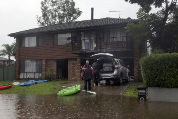 Steve Chase’s family are staying dry as water laps at their property in McGraths Hill.