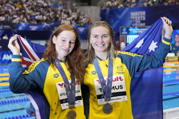 Gold medallist Mollie O’Callaghan of Australia, left, celebrates with her compatriot, silver medallist Ariarne Titmus