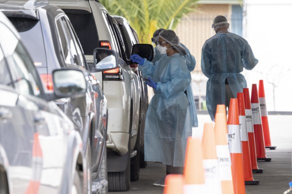 Staff conduct COVID-19 tests at a pop-up clinic at Al-Taqwa College in Truganina on Thursday. The school has been closed and all 2500 staff and students are isolating for 14 days.