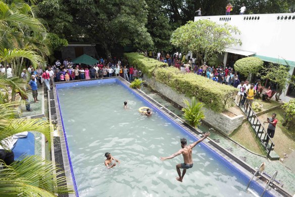 Protesters make use of the swimming pool in the Sri Lankan president’s official residence in Colombo.