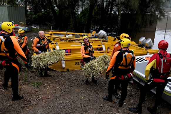 The SES, RFS and Marine Rescue NSW work together to assist residents cut off by floodwaters on the Hawkesbury River last year.