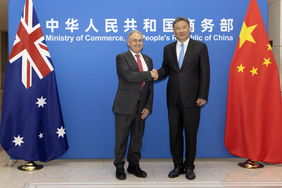 Trade Minister Don Farrell and Chinese Commerce Minister Wang Wentao in Beijing on Friday.