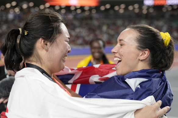 Javelin gold medallist Haruka Kitaguchi, of Japan, left, celebrates with bronze medallist Mackenzie Little as silver medallist Flor Denis Ruiz Hurtado, of Colombia (centre) smiles from afar.