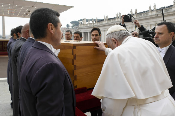Pope Francis tenderly touches the coffin of late Pope Emeritus Benedict XVI after his funeral mass in St. Peter’s Square at the Vatican.