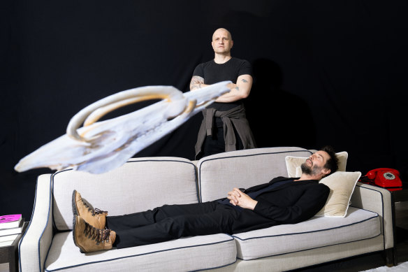 Keanu Reeves on the couch with co-author China Mieville.