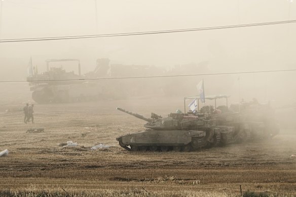 Israeli tanks parked in a staging area near the border with Gaza on Friday.