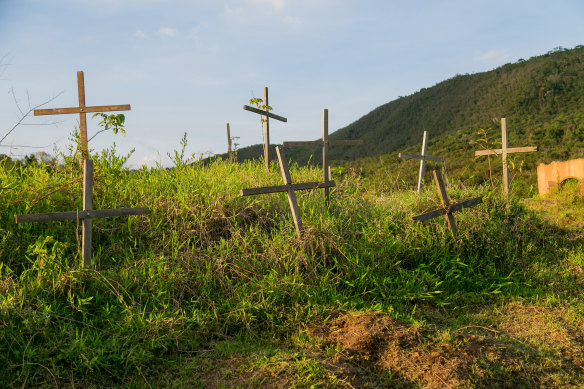Crosses remember the dead of the Samarco dam disaster in the now deserted village of Bento Rodrigues, Brazil. 