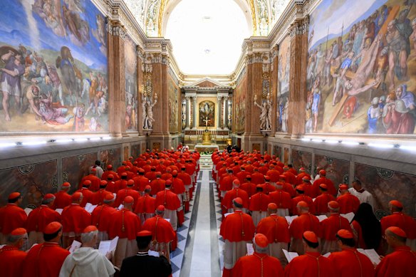 Cardinals gather in the Pauline Chapel before they form a procession to enter the Sistine Chapel to start the conclave.