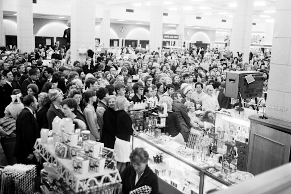 Crowds gather around a television in a David Jones department store in Sydney to watch a live telecast of the moon landing on July 21, 1969.
