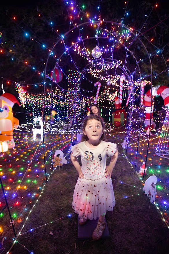 Pia explores her family’s Christmas display.