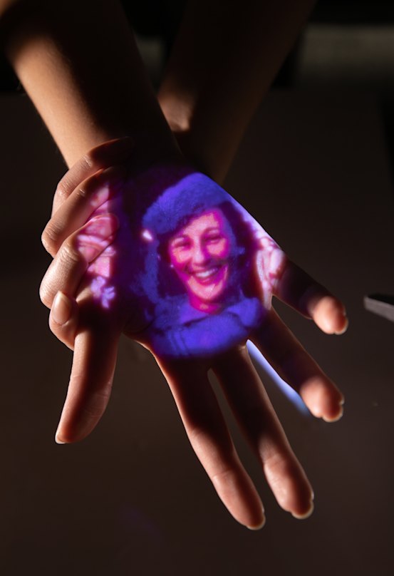 Home movies play out on a visitor’s hand in ACMI’s new Memory Garden.