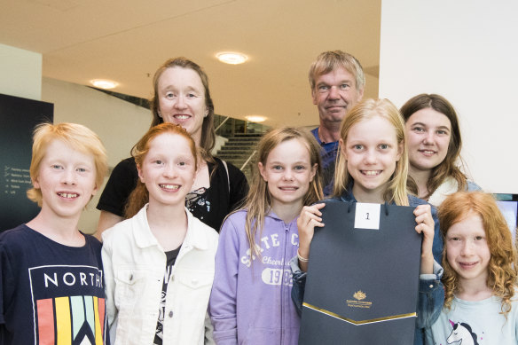 First coin strike winner Celeste Weerts with her family (from left) William Clissold, Emily Clissold, Sharon Clissold, Isabella Weerts, Trevor Weerts, Alicia Weerts and Isobelle Clissold at the Royal Australian Mint.