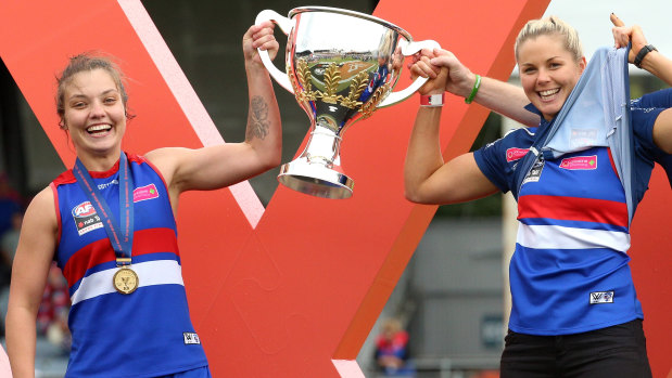 Ellie Blackburn is joined by Katie Brennan with the premiership cup.