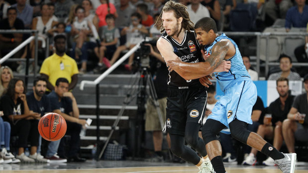 Craig Moller puts the pressure on Breakers playmaker Edgar Sosa.