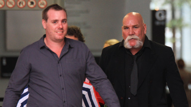 Peter John Nixon, and his son, Kurt Nixon, leave the Brisbane Supreme Court.