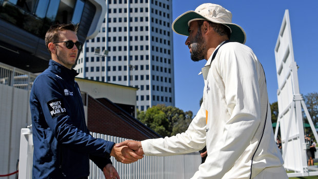 Done and dusted: NSW batsman Kurtis Patterson (left) congratulates bowler Fawad Ahmed of Victoria.