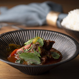 Pork curry with tomatillos and makrut lime leaves.