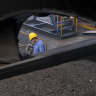 A worker monitors the coal dumping process at the Caofeidian Port in Hebei Province. 
