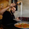 Mohammad Ismail with the first batch of Palestinian nabulsi knafeh at his Lakemba Nights stall.