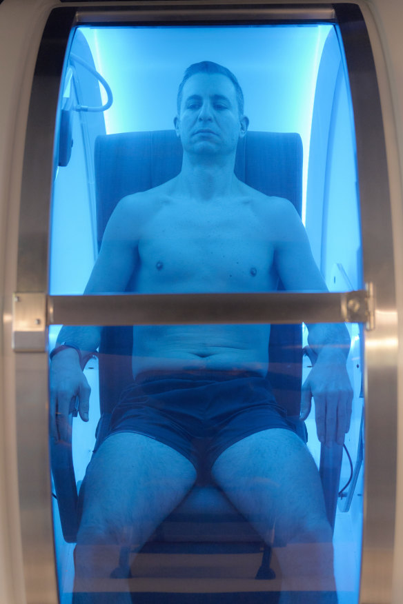 Tech entrepreneur Tristan Sternson relaxes in a hyperbaric chamber at Super Young, his life extension centre in Melbourne’s Armadale.