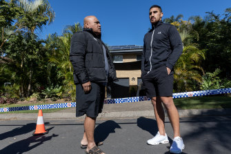 Australian boxer Justis Huni speaks with his father Rocki Huni (left) outside of the family home after the shooting.