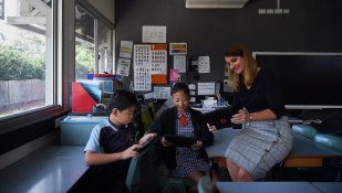 Waitara Public School principal Dany Coelho with students Beita Su and Bridget Choi.