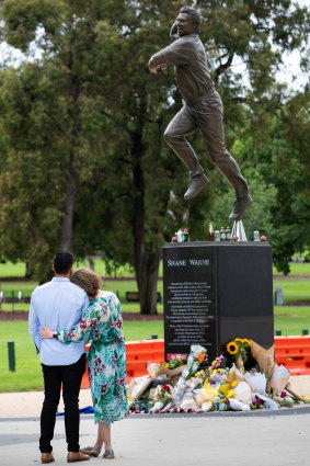 Tearful goodbyes: cricket fans pay tribute at Warne’s statue at the MCG.