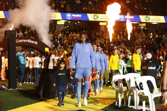 Wendie Renard of France leads the team out for the match between the Matildas and France at Marvel Stadium.