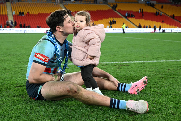 Mitchel Moses celebrated an Origin series win with his daughter Aspyn and a ruptured biceps.