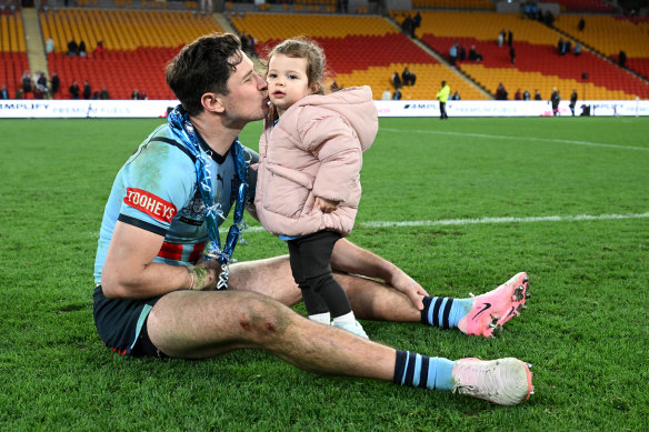 Mitchel Moses celebrates with his daughter Aspyn.