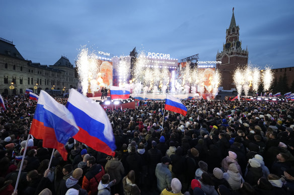 Many people were bused to the event, with some telling French media they supported Putin, others that they didn’t want to be there.