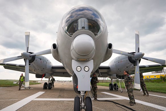 Technical personnel inspect a French Atlantique-2 submarine hunter aircraft after a NATO exercise in the Black Sea.