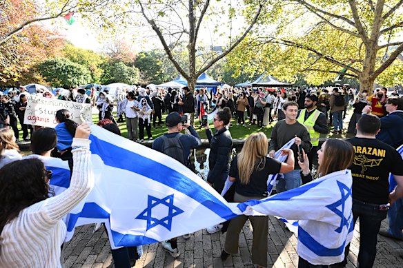Members of the Jewish community gather outside the pro-Palestinian camp at the University of Melbourne.