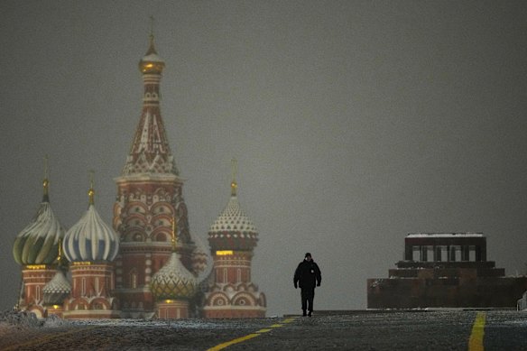 A police officer walks in the closed Red Square on New Year’s Eve in Moscow.
