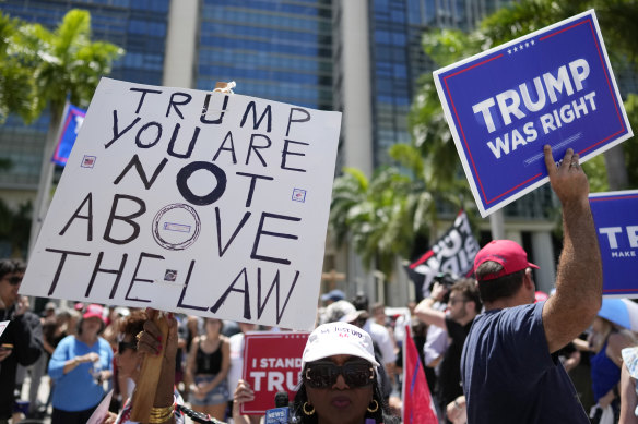 People rally outside the courthouse in Miami where Donald Trump appeared.