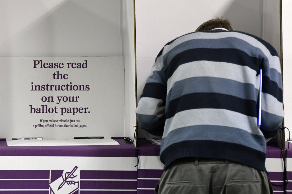 A voter casts a ballot in the federal election.