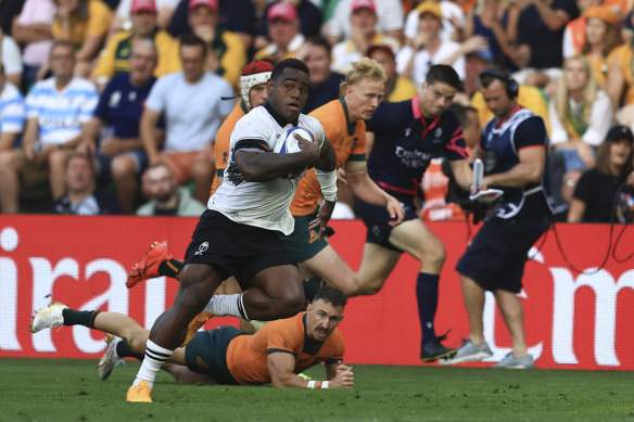 Fiji’s Josua Tuisova on the way to scoring for Fiji in their win over Australia at the Stade Geoffroy Guichard in Saint-Etienne.