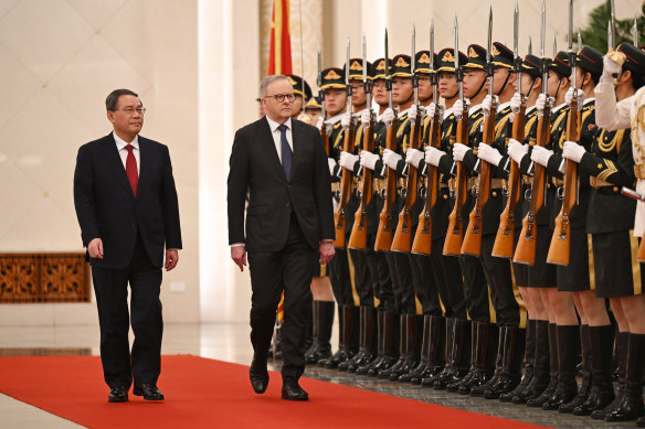 Prime Minister Anthony Albanese, with Chinese Premier Li Qiang,  arrives to a ceremonial welcome at the Great Hall of the People in Beijing.