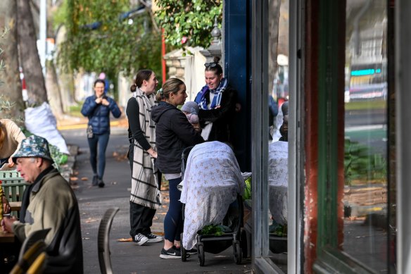 Customers line up outside Florian Eatery on Monday morning.