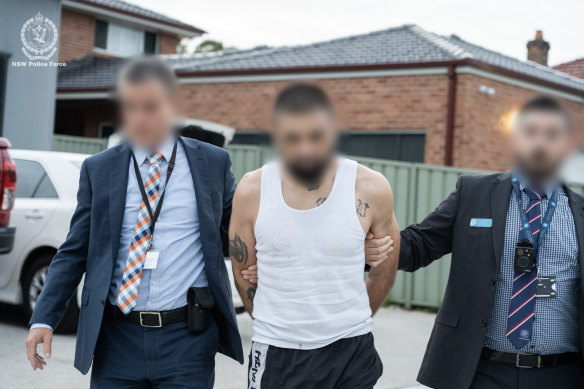 A man is arrested in Penshurst as part of Monday’s raids.